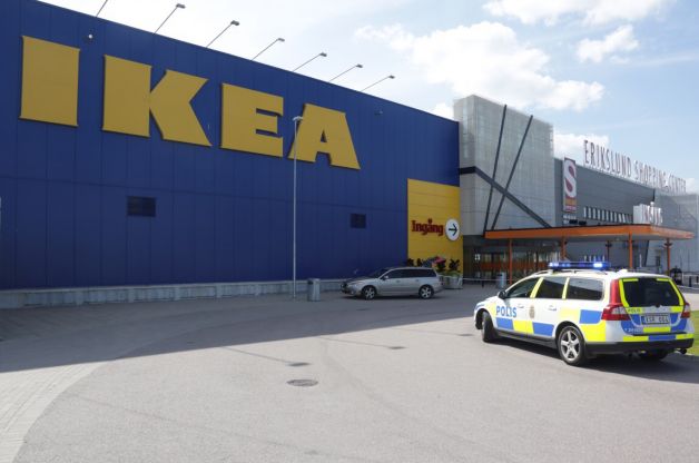 Police officers attend the Ikea store in Vasteras Sweden Monday Aug. 10 2015 after three people were injured in a knife attack at the store. SWEDEN OUT