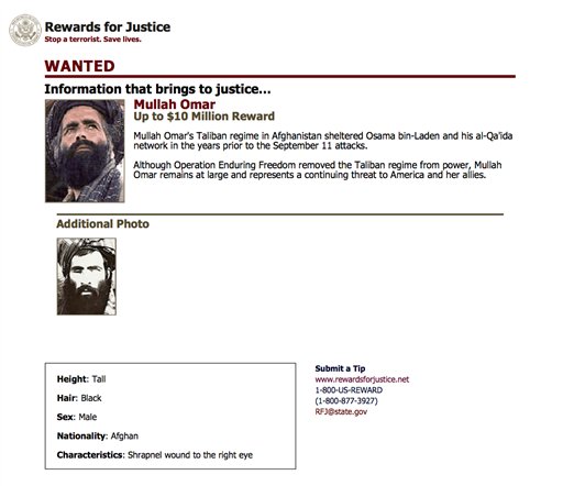 FILE- In this undated image released by the FBI Mullah Omar is seen in a wanted poster. An Afghan official says his government is examining claims that reclusive Taliban leader Mullah Omar is dead. The Taliban could not be immediately reached for commen