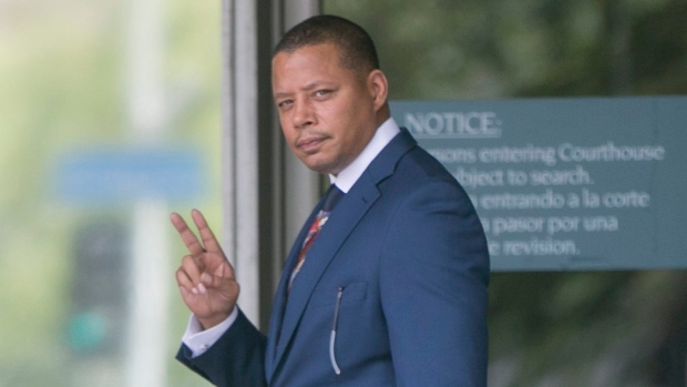 Terrence Howard walks into court