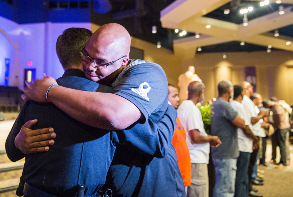 Adrian Taylor Jr. brother of Christian Taylor hugs Arlington Police Chief Will Johnson after a Unity Peace and Prayer rally for Christian Taylor on Wednesday at Cornerstone Church in Arlington. Taylor was shot and killed by Officer Brad Miller during