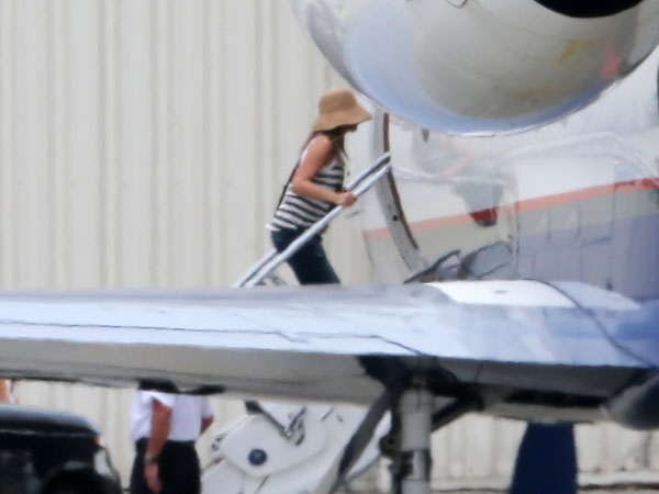 The Friends actress was spotted making her way onto their private jet