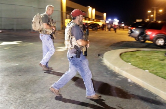 This video allegedly shows 18-year-old Tyrone Harris drawing a handgun after hearing shots fired during protests in Ferguson Mo. on Sunday