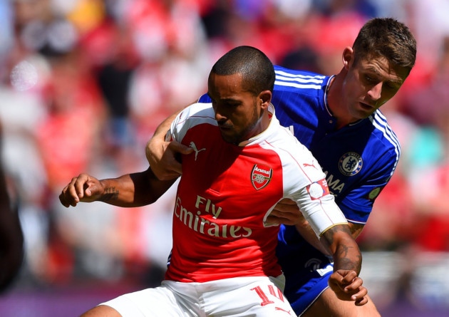 Theo Walcott of Arsenal and Gary Cahill of Chelsea