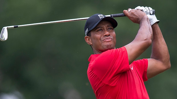 Tiger Woods watches his shot from the third tee during the final round of the Wyndham Championship golf tournament at Sedgefield Country Club in Greensboro N.C. on Sunday