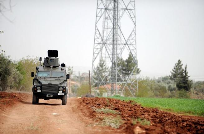 A Turkish army vehicle patrols near the border with Syria in Kilis on 11 April 2012