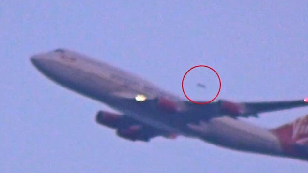 UFO captured on film overtaking a flight from JFK Airport