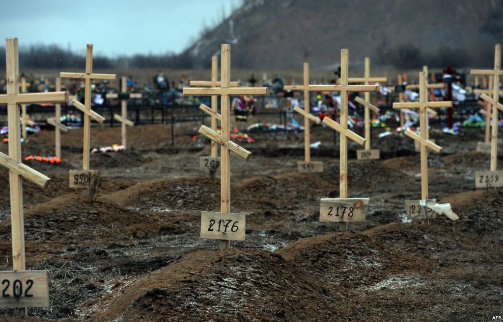 Crosses marked only with numbers stand on the graves of unknown pro Russian separatists at a cemetery in the eastern Ukrainian city of Donetsk in February