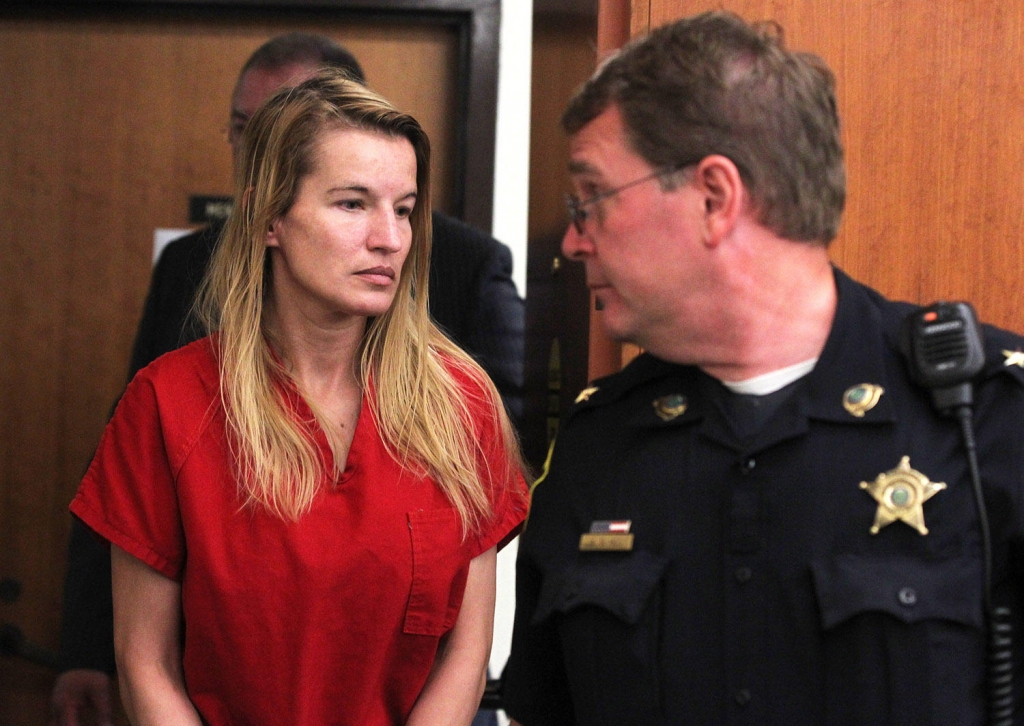 Jody Herring is led out of court after her arraignment in Vermont Superior Court in Barre on Monday Aug. 10. The 40-year-old woman from Barre Town has pleaded not guilty to shooting and killing a DCF social worker on Friday