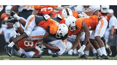 Team 119 held its first full-pads practice of preseason camp on sunny Saturday at Haslam Field