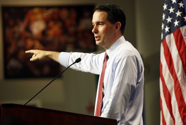 Republican presidential candidate Wisconsin Gov Scott Walker speaks during a campaign stop called Politics and Eggs with business leaders and political activist