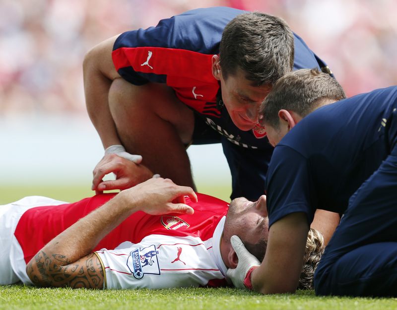 Arsenal's Olivier Giroud receives treatment after sustaining an injury during the Barclays Premier League match against West Ham United at Emirates Stadium.- Reuters pic