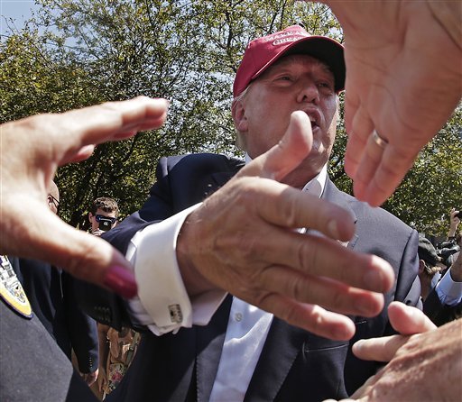 Republican presidential candidate Donald Trump greats the crowd at the Iowa State Fair Saturday Aug. 15 2015 in Des Moines