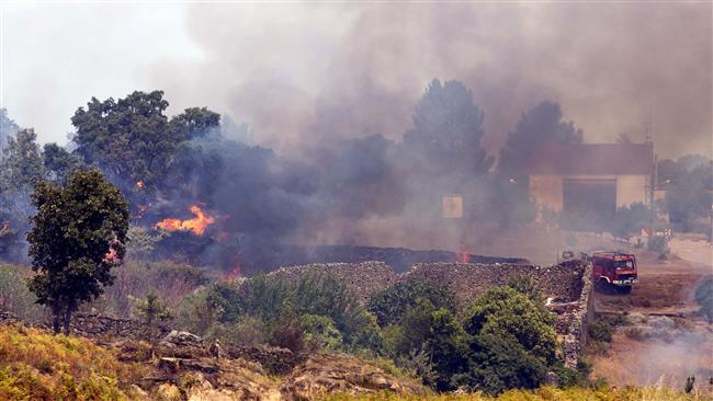 A fire truck operates near the village of Hoyos in the province of Cáceres Extremadura Spain