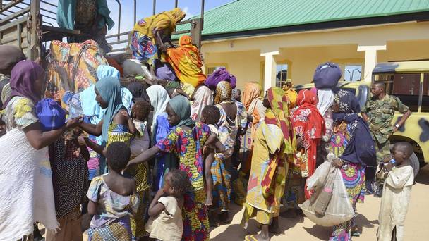 Women and children rescued by Nigerian soldiers from Boko Haram extremists in the north-east of Nigeria arrive at the military office in Maiduguri