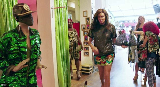 Work it: Caitlyn Jenner tries to copy her model daughter's catwalk strut as she tries on some new outfits in the latest clip for I Am Cait