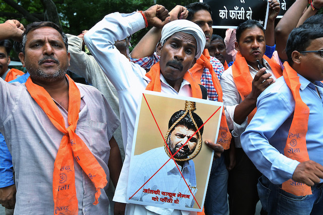 Indian activists of hardline organization Hindu Sena hold posters and shout slogans in support of the death sentence for Yakub Memon convicted for involvement in 1993 Mumbai attack in New Delhi India