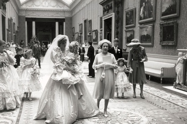 Princess Diana holding the five-year-old Clementine Hambro her youngest bridesmaid PA