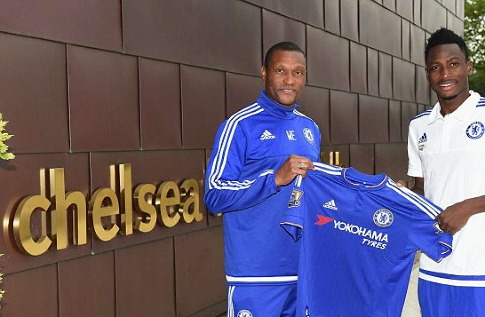 PHOTO: Baba Rahman holding a Chelsea shirt