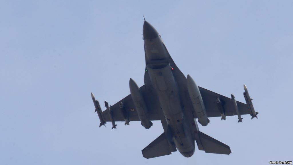 A missile-loaded Turkish Air Force warplane rises in the sky after taking off from Incirlik Air Base in Adana Turkey Wednesday