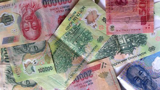 Vietnam devalues currency by 1 percent