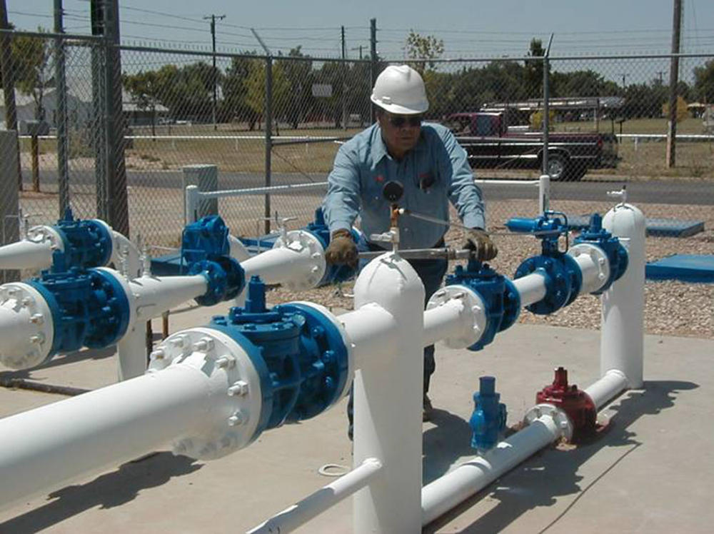 A New Mexico Gas Co. technician checks the utility’s pipes. Courtesy