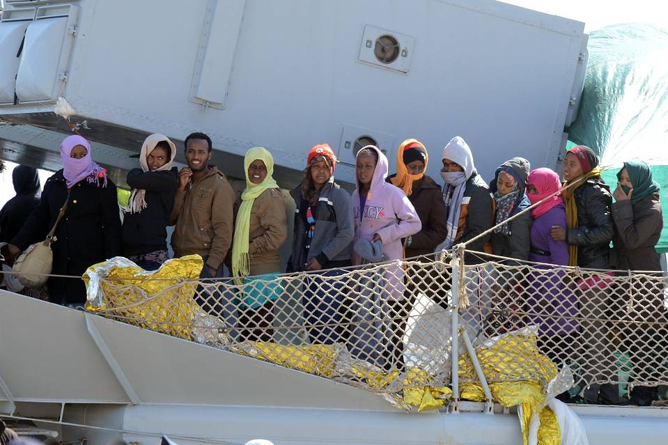 A boat transporting migrants arrives in the port of Messina in Sicily after a rescue operation