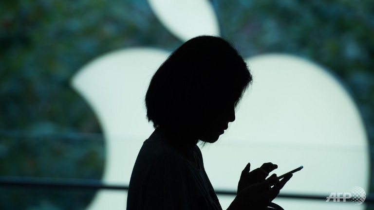 A customer uses her new smartphone during the release of the iPhone 6s at an Apple store in Shanghai.
   
 

  Enlarge  Caption