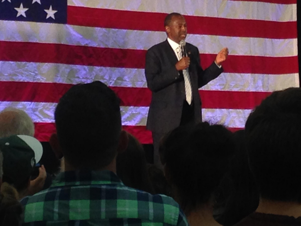 A giant US flag served as the backdrop for Dr. Ben Carson at a campaign rally on the campus of Spring Arbor University