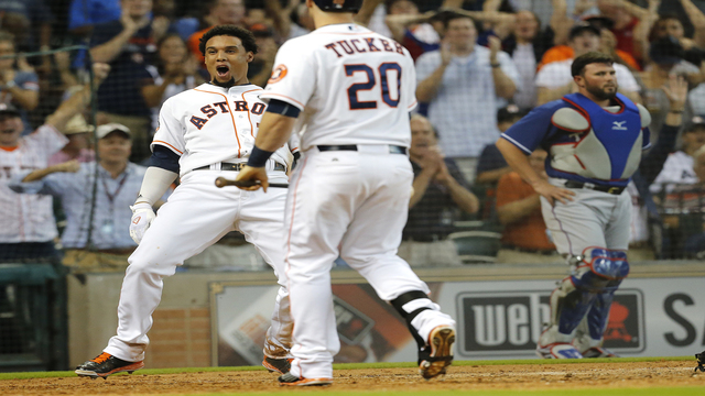 HOUSTON TX- SEPTEMBER 27 Carlos Gomez #30 of the Houston Astros reacts after scoring against the Texas Rangers during the eighth inning at Minute Maid Park