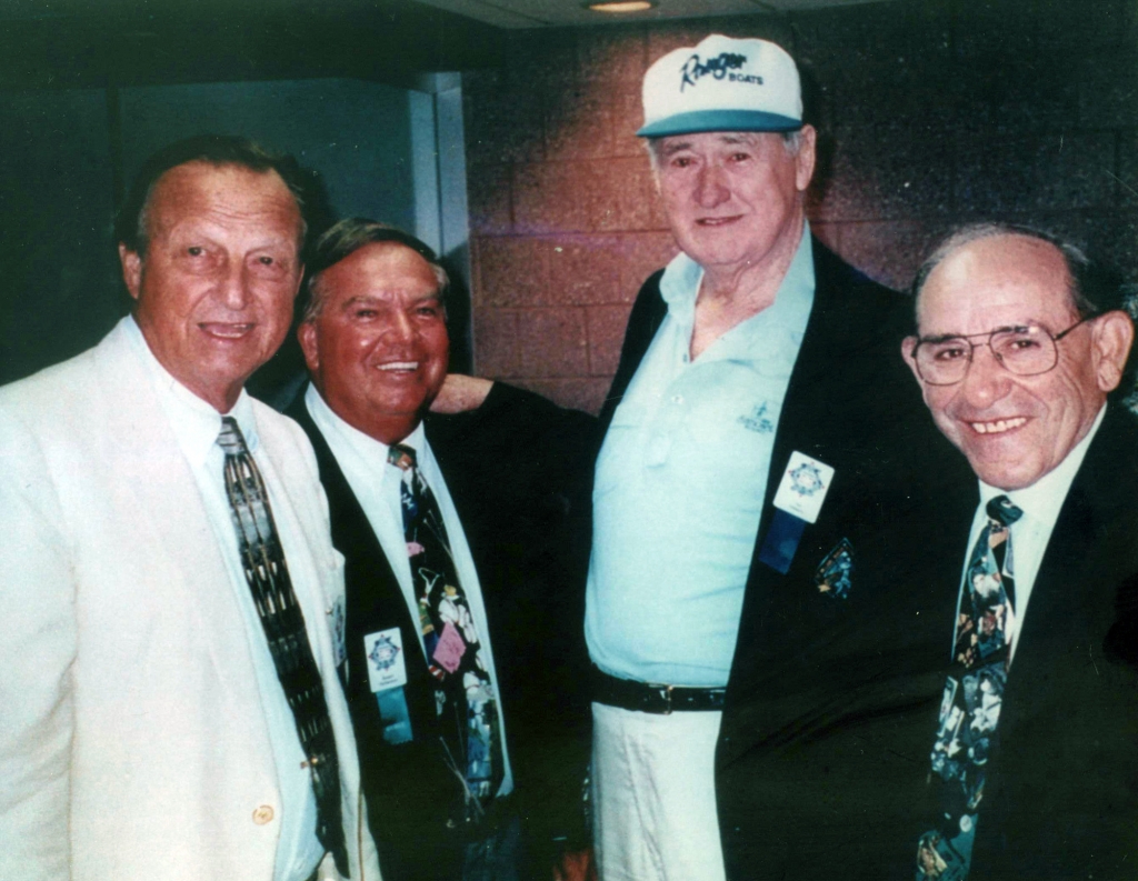 Baseball Hall of Famers Stan Musial Bobby Richardson Ted Williams and Yogi Berra pose for