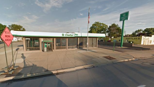 The alleged robber was shot in Warren Michigan. The bank formerly known as Charter Bank was recently rebranded as a Citizens Bank