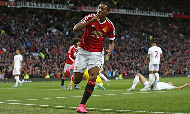 Anthony Martial celebrates after scoring on his debut for Manchester United against Liverpool at Old Trafford to make it 3-1 in the Premier League game