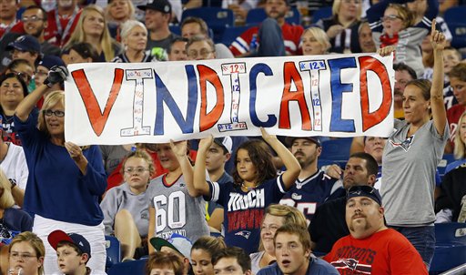 New England Patriots fans hold a sign that refers to Patriots quarterback Tom Brady in the first half of an NFL football game between the Patriots and the New York Giants Thursday Sept. 3 2015 in Foxborough Mass. Federal Judge Richard M. Berman overtu