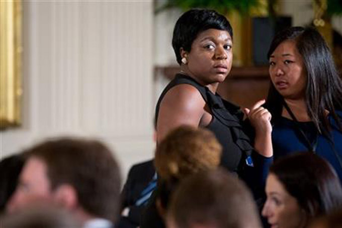 2015 White House Social Secretary Deesha Dyer is seen standing second from right in the East Room of the White House in Washington