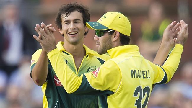 Ashton Agar celebrates taking his first ODI wicket with Glenn Maxwell