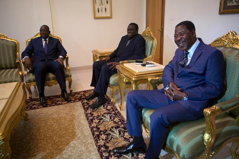 Sengalese President Macky Sall and Beninois President Thomas Boni Yayi with Burkinabe transitional President Michel Kafando at the president's residence in Burkina Faso