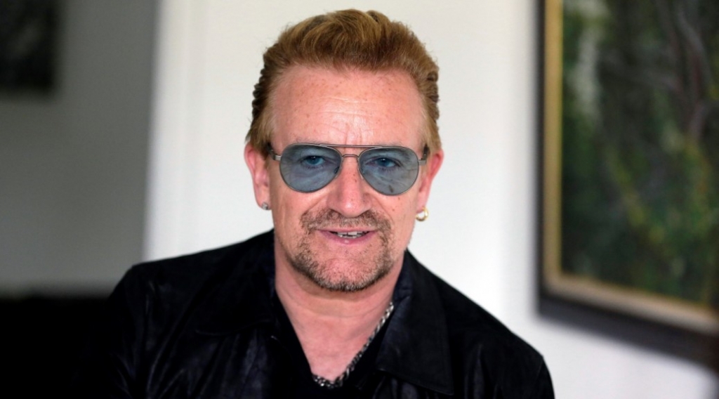 Bono joins chorus for refugees as U2 kick off European leg of tour