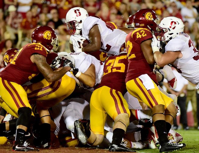 Remound Wright dives into the end zone for one of his three touchdowns on the night for Stanford