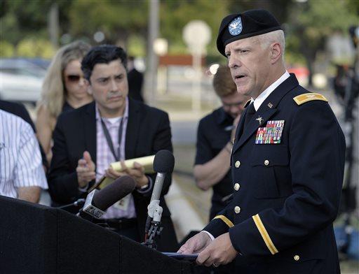 Col. Daniel J.W. King right U.S. Army Forces Command Director of Public Affairs speaks to members of the media after a preliminary hearing to determine if Sgt. Bowe Bergdahl should face a court-martial