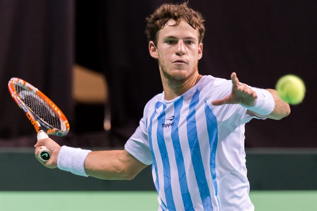 Argentina's Diego Schwartzman returns the ball to Belgium's David Goffin during the third singles match at the Davis Cup World Group semifinals between Belgium and Argentina in Brussels Sunday Sept. 20 2015