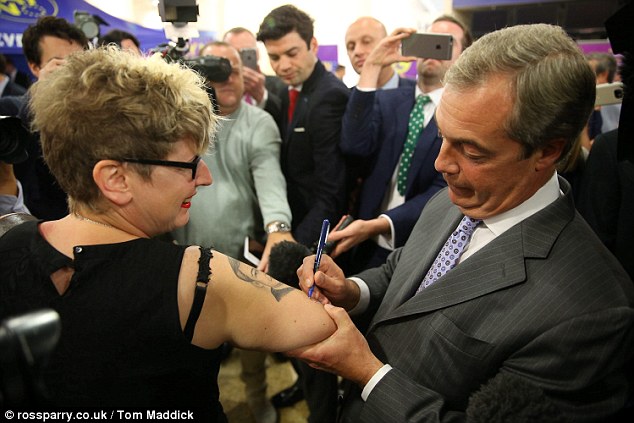 Mr Farage was mobbed by party supporters as he arrived at the Yorkshire town's racecourse today- with one fan Kerrie Webb, even turning up with a tattoo of the party leader