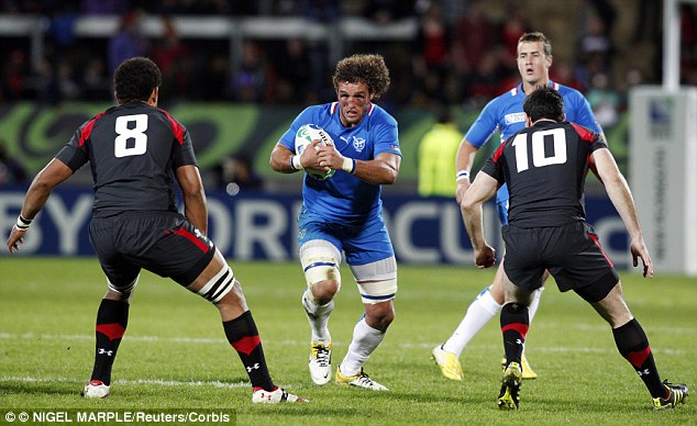 Burger runs at Wales for Namibia in the 2011 World Cup where he was named in the team of the tournament