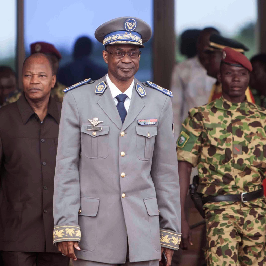 Burkina Faso coup leader Gen. Gilbert Diendere waits for Senegal President Macky Sall to arrive at the airport for talks in Ouagadougou Burkina Faso last week