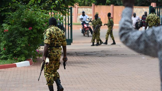 Soldiers of the Presidential Security Regiment patrol in the Burkinabe capital Ougadougou