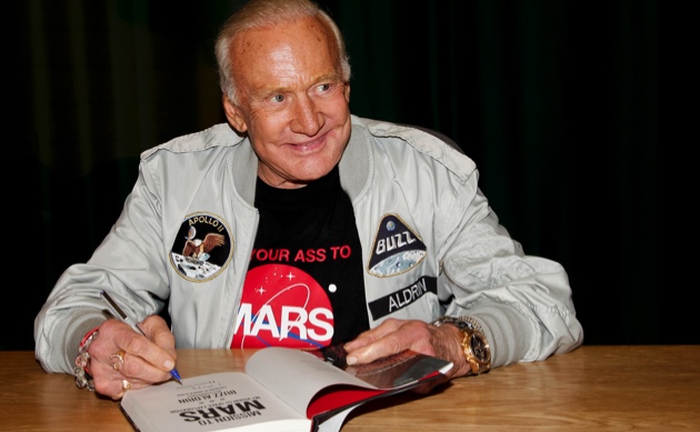 Buzz Aldrin signs copies of his book