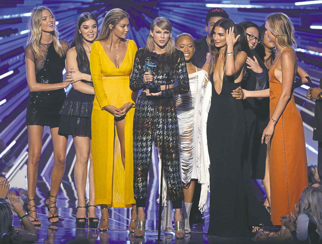 Swift centre with her coterie of friends accepts the award for Video of the Year for Bad Blood