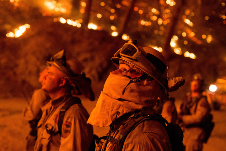 Firefighters monitor a backfire while battling the Butte fire near San Andreas California