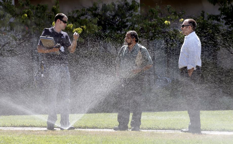 Water auditor with the Marin Municipal Water District Craig Lauridsn meets with landscaper Vince Gray of Trugreen Landscaping Vince Gray and Acqua Hotel general manager Justin Flake as they monitor the water flow to sprinklers at the Acqua Ho