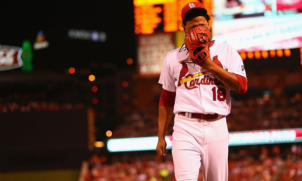 ST. LOUIS MO- SEPTEMBER 25 Starter Carlos Martinez #18 of the St. Louis Cardinals reacts after being pulled from the game against the Milwaukee Brewers due to shoulder tightness in the first inning at Busch Stadium