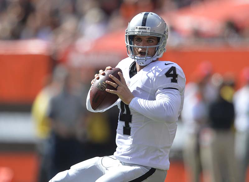 Oakland Raiders quarterback Derek Carr looks to pass against the Cleveland Browns on Sunday